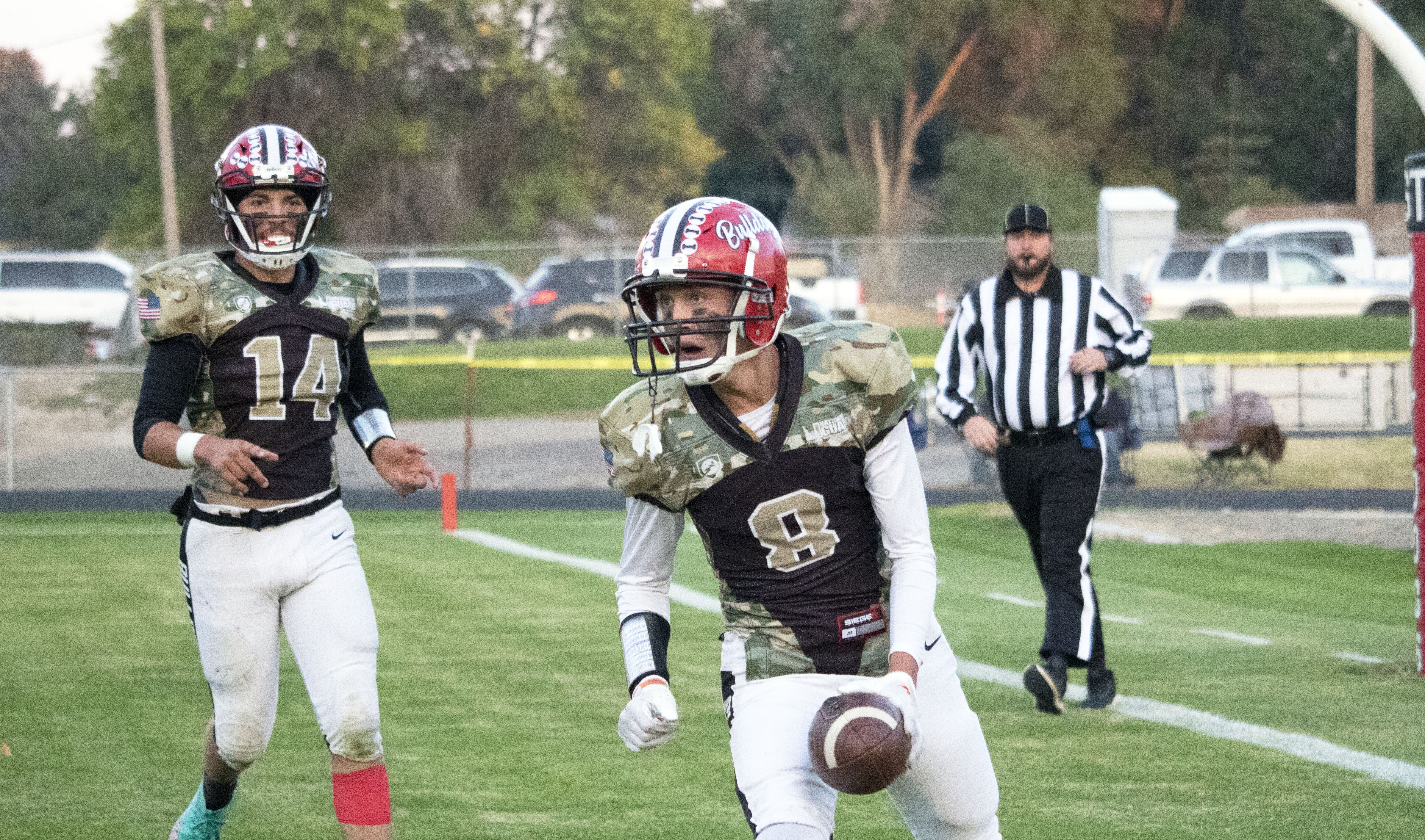 Kasen Hammond and Parker Stringham celebrate a touchdown during a game against Filer. | Photo by Talan Volkel