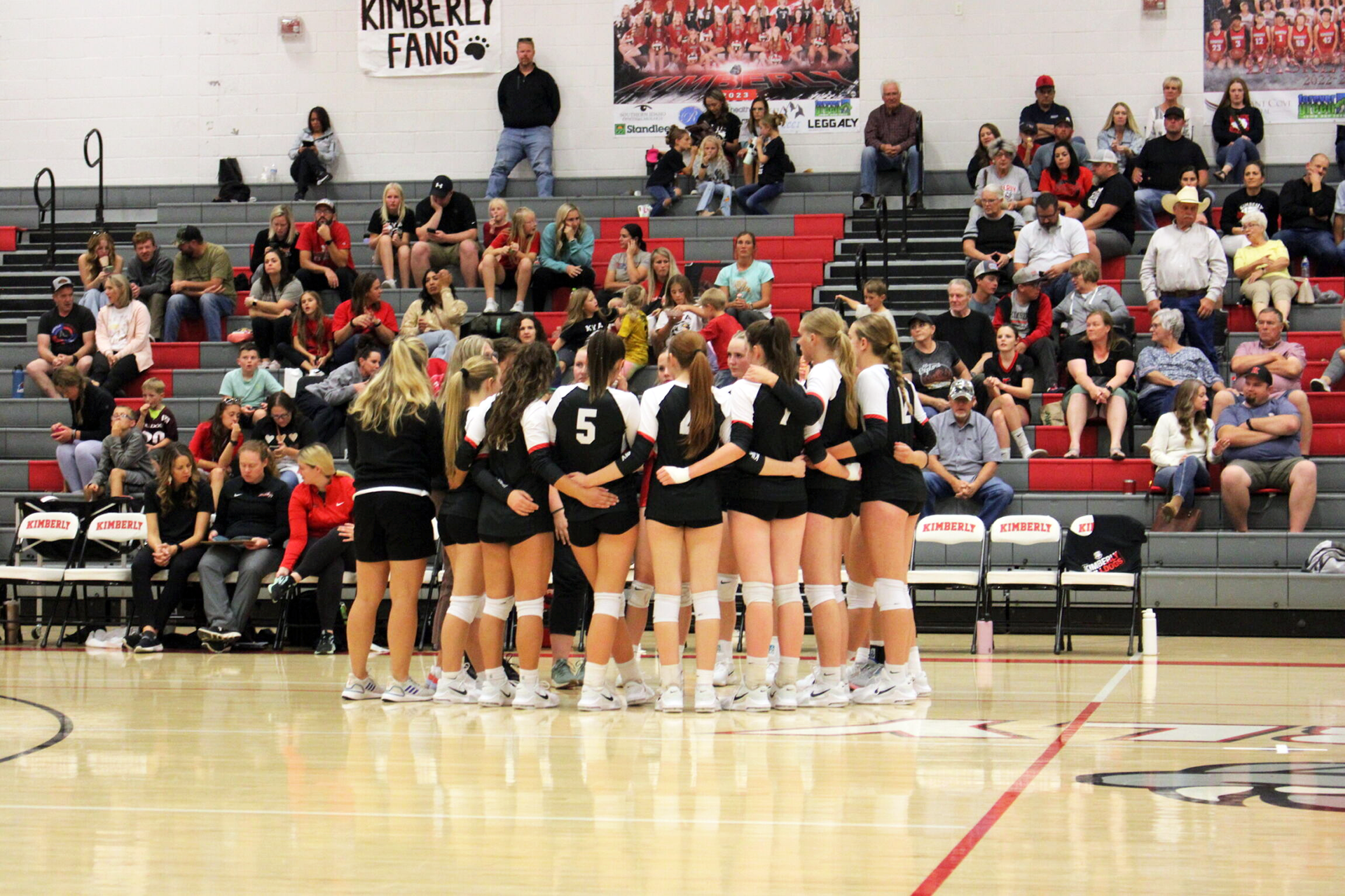 The KHS volleyball team meets before a match this season. | Photo by Publications staff