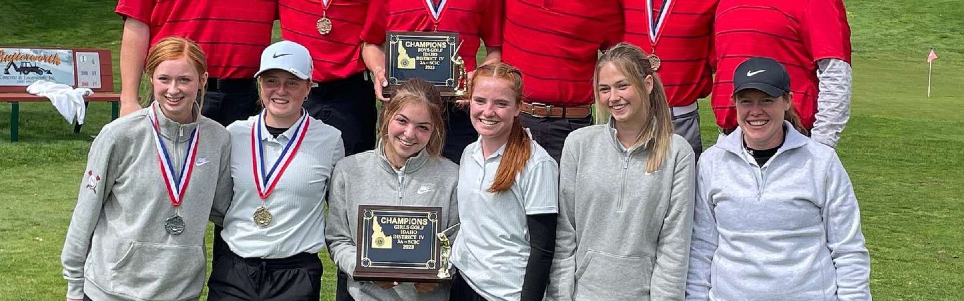 The KHS girls and boys golf teams pose with their district championship plaques. | Photo via Kimberly Booster Club