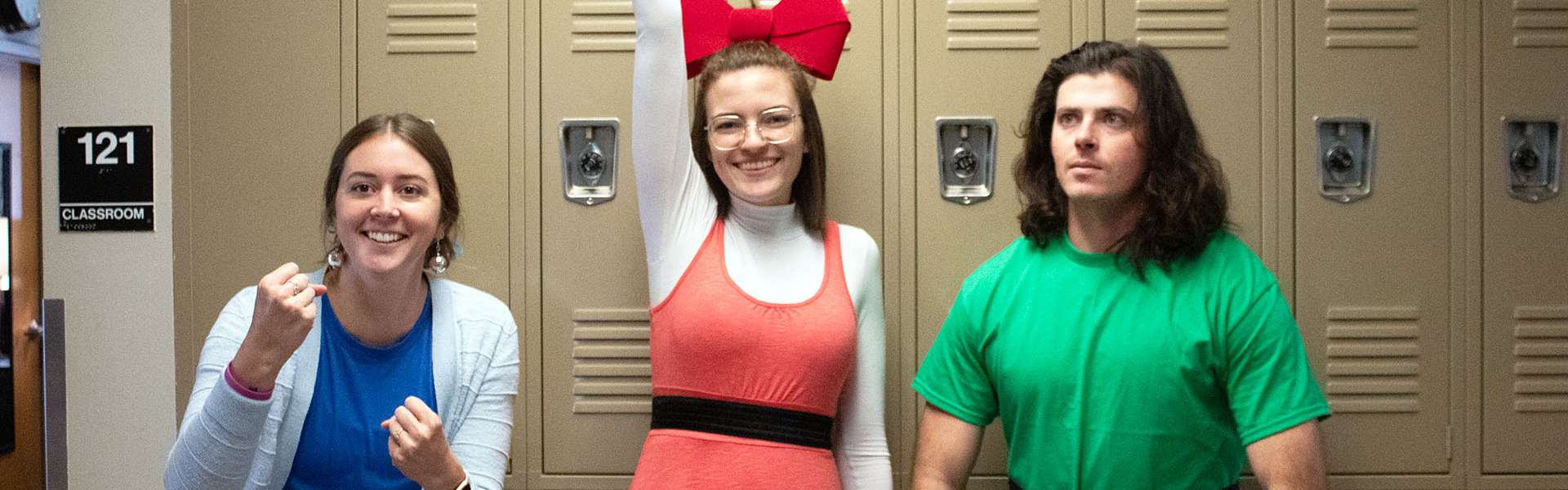 Mrs. Crockett (Bubbles), Miss Klahman (Blossom), and Mr. Bedke (Buttercup) pose as the Powerpuff Girls on Halloween. | Photo by Paizlee Goff
