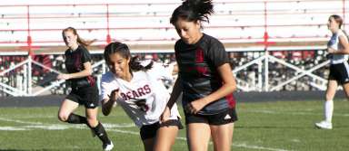 Senior Monse Torres moves the ball down the field during a game against Bliss. | Photo by Talan Volkel