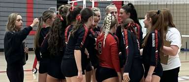 The KHS varsity volleyball team gets together during a match against Filer on Thursday, Sept. 15. | Photo by Brynlee Noble