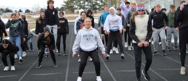 Senior Emily Ramirez and other members of the track and field team warm up during a cold practice this spring. | Photo by Kaya Thomas