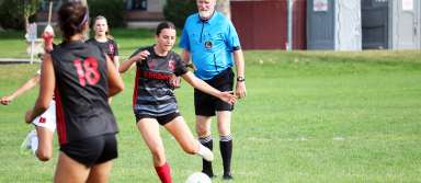 Senior Ava Wyatt kicks the ball during a game this season. | Photo by Publications staff