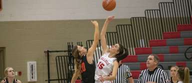 Senior Kelsy Stanger tips off during a game against Buhl this season. | Photo by Staff