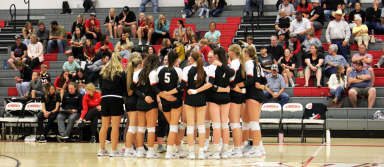 The KHS volleyball team meets before a match this season. | Photo by Publications staff